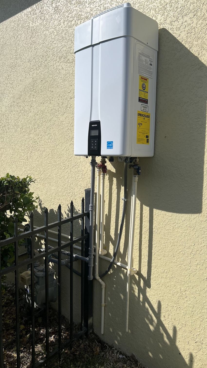 Navien tankless water heater installed outdoors by Choice Plumbing Orlando